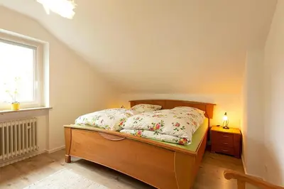 Ein Bett oder Betten in einem Zimmer der Unterkunft Ferienwohnung Spitzbergblick