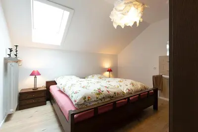 Ein Bett oder Betten in einem Zimmer der Unterkunft Ferienwohnung Spitzbergblick
