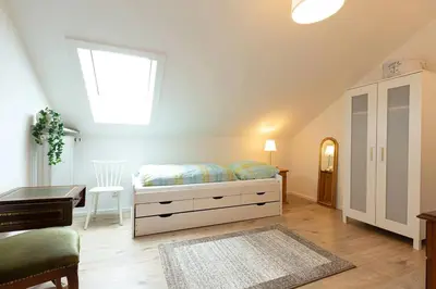 Ein Bett oder Betten in einem Zimmer der Unterkunft Ferienwohnung Spitzbergblick