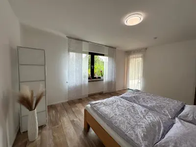 Ein Bett oder Betten in einem Zimmer der Unterkunft Ferienwohnung 