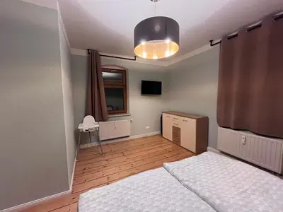 Ein Bett oder Betten in einem Zimmer der Unterkunft NEU! Vogtland Herberge Grünbach