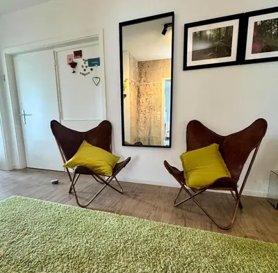 Ein Sitzbereich in der Unterkunft Ferienwohnung Fichtel-STEIN
