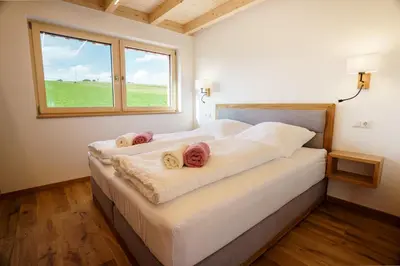 Ein Bett oder Betten in einem Zimmer der Unterkunft Chalet Auszeit im Schönseer Land