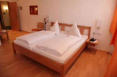 Ein Bett oder Betten in einem Zimmer der Unterkunft Gasthof Hotel Bauer