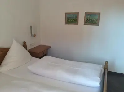 Ein Bett oder Betten in einem Zimmer der Unterkunft Gasthof Hotel Bauer