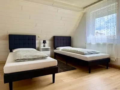 Ein Bett oder Betten in einem Zimmer der Unterkunft Family Apartment Bayreuth Festspielhaus