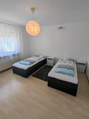 Ein Bett oder Betten in einem Zimmer der Unterkunft Family Apartment Bayreuth Festspielhaus