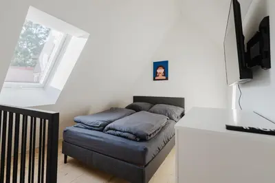 Ein Bett oder Betten in einem Zimmer der Unterkunft Stilvolles Wohnen am Ziegeltor - Für Gruppen, Pärchen und Singles