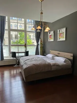 Ein Bett oder Betten in einem Zimmer der Unterkunft Im Herzen Plauen