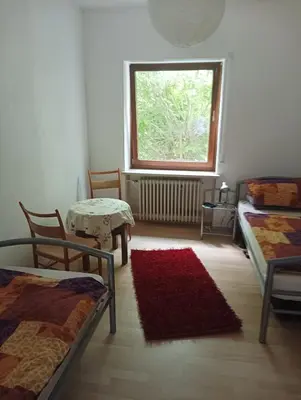 Ein Bett oder Betten in einem Zimmer der Unterkunft FEWO Schwunk