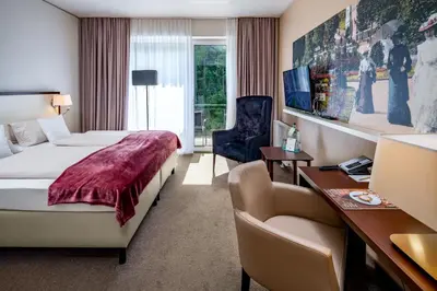 Ein Bett oder Betten in einem Zimmer der Unterkunft Hotel König Albert