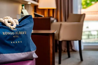 Ein Zertifikat, Auszeichnung, Logo oder anderes Dokument, das in der Unterkunft Hotel König Albert ausgestellt ist