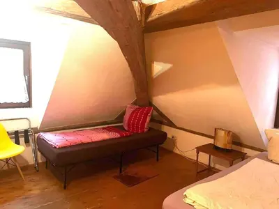 Ein Bett oder Betten in einem Zimmer der Unterkunft Wohnung im Zentrum Altstadtflair mit Holz und Stil