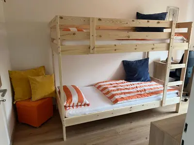 Ein Bett oder Betten in einem Zimmer der Unterkunft Ferienwohnung Am Blauen Hügel in Eckersdorf