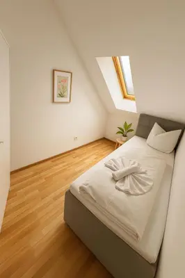 Ein Bett oder Betten in einem Zimmer der Unterkunft SUNNYHOME Monteurwohnungen und Apartments in Schwandorf