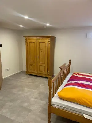 Ein Bett oder Betten in einem Zimmer der Unterkunft Ferienwohnung Am Sand