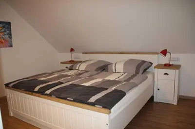 Ein Bett oder Betten in einem Zimmer der Unterkunft Ferienwohnung Pajonk