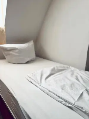 Ein Bett oder Betten in einem Zimmer der Unterkunft Das Siegener Familien-Residenz