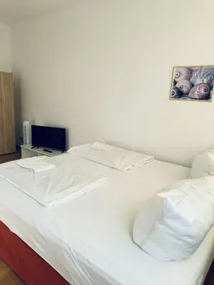 Ein Bett oder Betten in einem Zimmer der Unterkunft Das Siegener Familien-Residenz