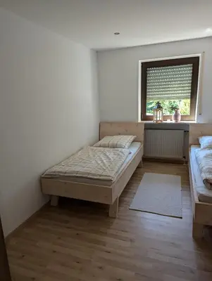 Ein Bett oder Betten in einem Zimmer der Unterkunft Ferienwohnung Sperber