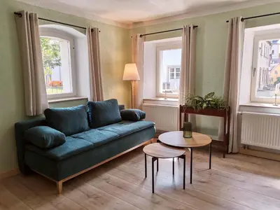 Ein Sitzbereich in der Unterkunft Ferienwohnung beim Gangolfsturm