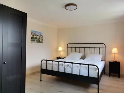Ein Bett oder Betten in einem Zimmer der Unterkunft Ferienwohnung beim Gangolfsturm