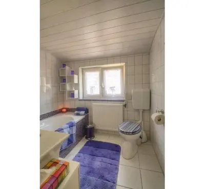 Ein Badezimmer in der Unterkunft Haus Ella