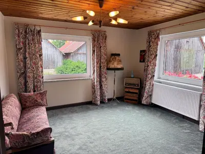 Ein Sitzbereich in der Unterkunft Ferienhaus Glücklich am Bach