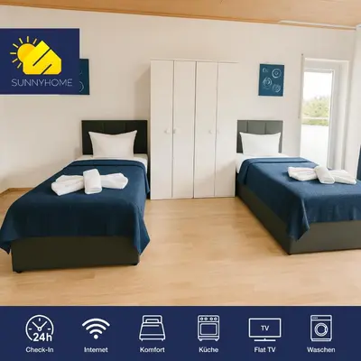 Ein Bett oder Betten in einem Zimmer der Unterkunft SUNNYHOME Monteurwohnungen und Apartments in Weiden