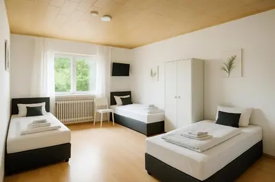 Ein Bett oder Betten in einem Zimmer der Unterkunft SUNNYHOME Monteurwohnungen und Apartments in Weiden