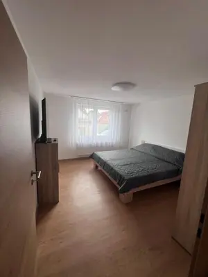 Ein Bett oder Betten in einem Zimmer der Unterkunft Busu