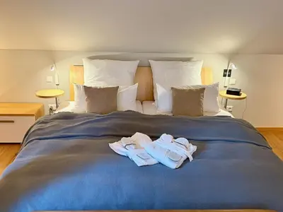 Ein Bett oder Betten in einem Zimmer der Unterkunft Domizil am Festspielhaus