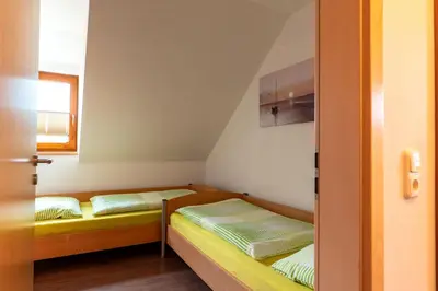 Ein Bett oder Betten in einem Zimmer der Unterkunft Eslarner Zoiglstum beim Strehern