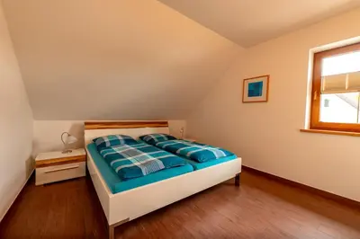 Ein Bett oder Betten in einem Zimmer der Unterkunft Eslarner Zoiglstum beim Strehern