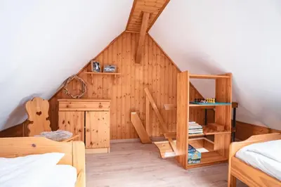 Ein Bett oder Betten in einem Zimmer der Unterkunft Ferienwohnung Am Wald