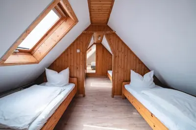 Ein Bett oder Betten in einem Zimmer der Unterkunft Ferienwohnung Am Wald