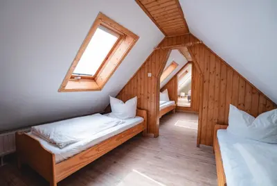 Ein Bett oder Betten in einem Zimmer der Unterkunft Ferienwohnung Am Wald