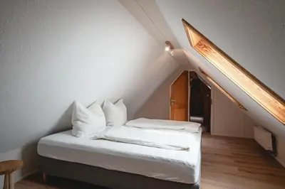 Ein Bett oder Betten in einem Zimmer der Unterkunft Ferienwohnung Am Wald
