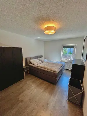 Ein Bett oder Betten in einem Zimmer der Unterkunft Ferienwohnung mit Dachterrasse