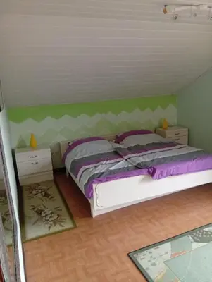 Ein Bett oder Betten in einem Zimmer der Unterkunft Ferienwohnung Baumann Alois