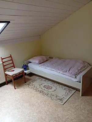 Ein Bett oder Betten in einem Zimmer der Unterkunft Ferienwohnung Baumann Alois