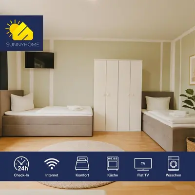Ein Bett oder Betten in einem Zimmer der Unterkunft SUNNYHOME Monteurwohnungen und Apartments in Weiden