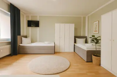 Ein Bett oder Betten in einem Zimmer der Unterkunft SUNNYHOME Monteurwohnungen und Apartments in Weiden