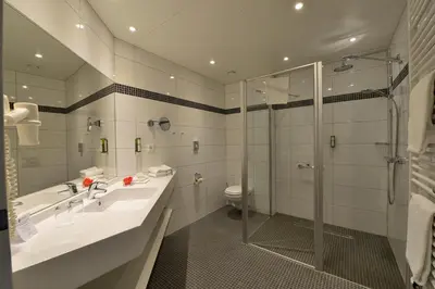 Ein Badezimmer in der Unterkunft Aribo Hotel