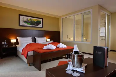 Ein Bett oder Betten in einem Zimmer der Unterkunft Aribo Hotel