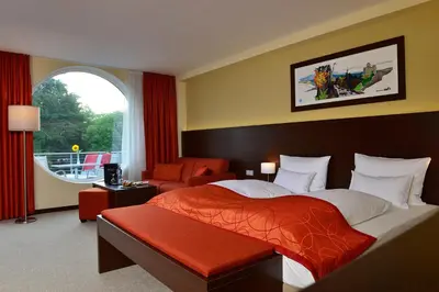 Ein Bett oder Betten in einem Zimmer der Unterkunft Aribo Hotel