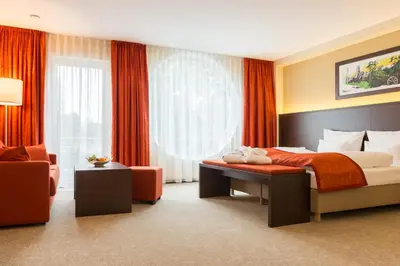 Ein Bett oder Betten in einem Zimmer der Unterkunft Aribo Hotel