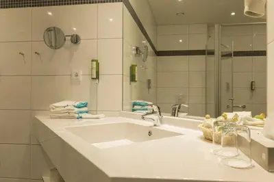 Ein Badezimmer in der Unterkunft Aribo Hotel