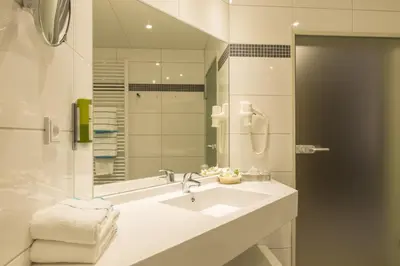 Ein Badezimmer in der Unterkunft Aribo Hotel