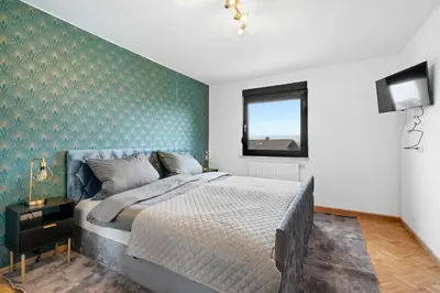 Ein Bett oder Betten in einem Zimmer der Unterkunft Knappenstube